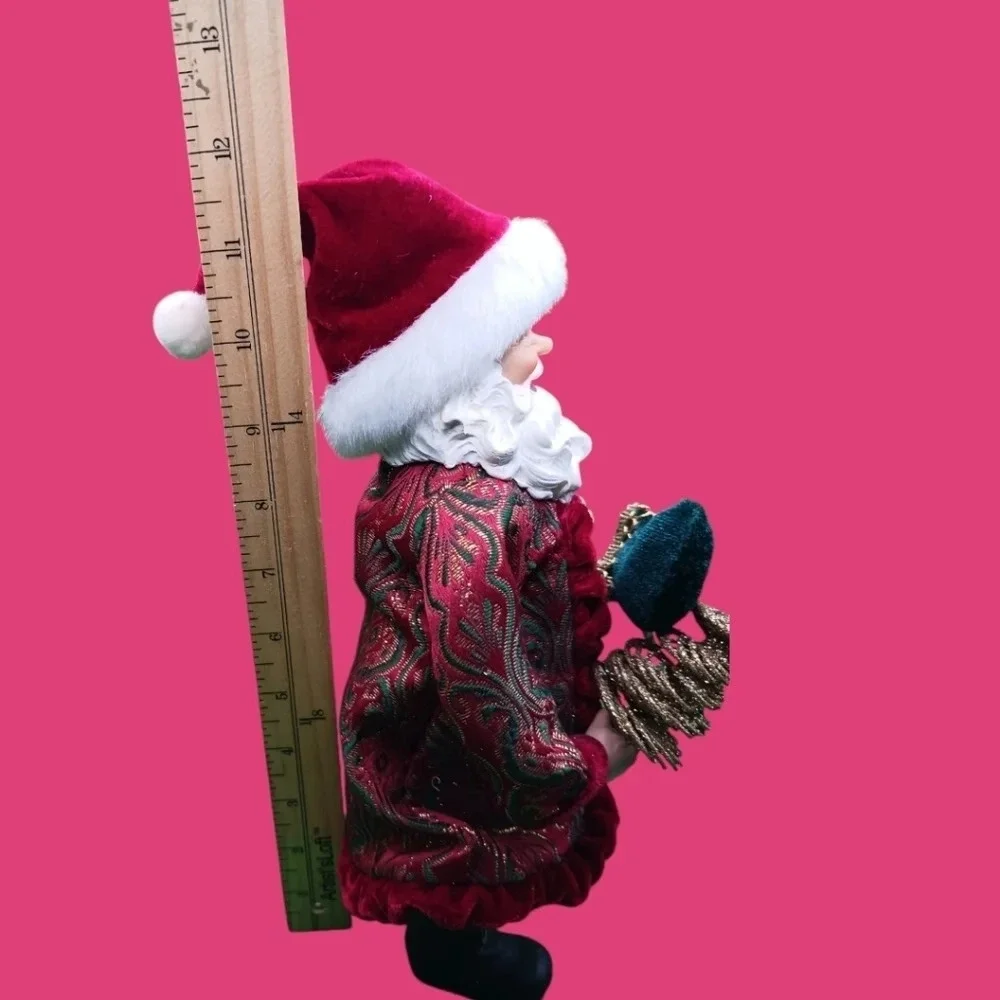 Vintage santa holding gold tree and boot